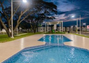 a swimming pool in a park at night at Casa Migueleña in San Miguel
