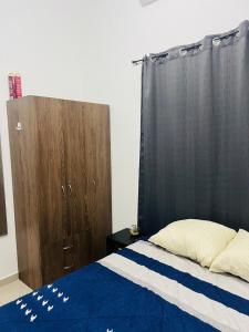 a bedroom with a bed and a wooden cabinet at Casa Migueleña in San Miguel +18 photos