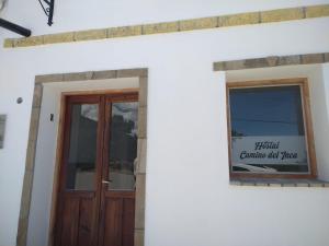 a front door of a house with a sign on it at Camino del Inca in Cachí