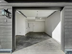 an empty garage with an open door in a building at Terrace at Two Rivers townhouse in Grand Junction