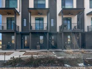 an apartment building with balconies and a courtyard at Terrace at Two Rivers townhouse in Grand Junction