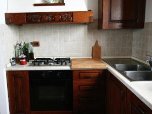 A kitchen or kitchenette at Farmhouse in Asciano with Pool and Countryside