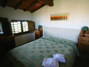 A bed or beds in a room at Farmhouse in Asciano with Pool and Countryside