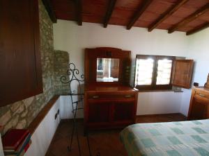 A bed or beds in a room at Farmhouse in Asciano with Pool and Countryside