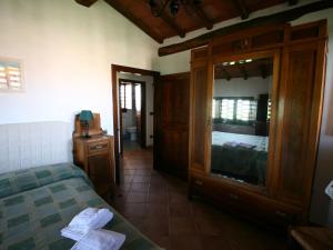 A bed or beds in a room at Farmhouse in Asciano with Pool and Countryside