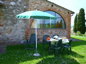 A garden outside Farmhouse in Asciano with Pool and Countryside