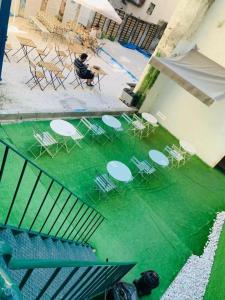 an overhead view of chairs and tables in a courtyard at Samps Hostel in Lisbon +36 photos