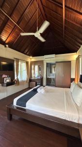 a large bedroom with a large bed with a ceiling at Balangan Surf Resort in Jimbaran +37 photos