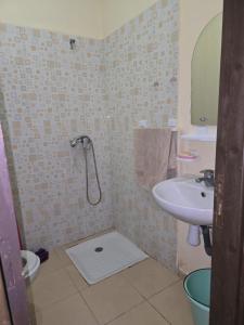 a bathroom with a shower and a sink at ALmas apparemment in Ifrane