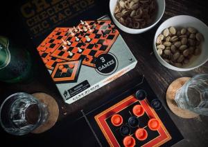 a table with a chess game andocolates on it at Caba La Union Gulfside Cottage C3 in Caba