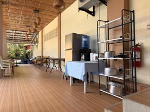 an empty room with a table and a kitchen at Blue Villa - Entire House with Private Pool in Panglao Island +9 photos