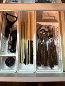 a drawer full of utensils in a cabinet at BreakPoint in Ichinomiya