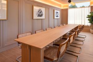 a large conference room with a long table and chairs at B&B HOTEL Madrid Vallecas Ensanche in Madrid