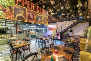 an empty restaurant with wooden tables and chairs at GaasBaasCompany, Thamel, Kathmandu in Kathmandu
