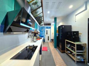 a kitchen with a counter and a stove in it at Arawan Pool Villa Hua Hin in Hua Hin
