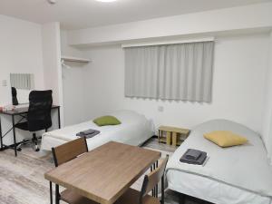 Posteľ alebo postele v izbe v ubytovaní Hotel Chuo Oasis