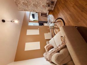 a living room with a couch and a lamp at Kadéraf in Cherbourg en Cotentin