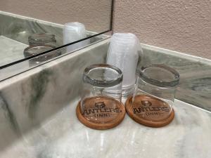 a couple of glass jars sitting on top of a counter at Antlers Inn in Chester +47 photos
