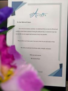 a letter from the civil rights coalition to the american civil liberties union with flowers at The Answer Hotel in Ao Nang Beach