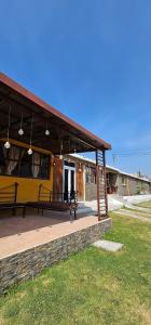 a building with benches sitting on a patio at EL MIRADOR dlr HR in Quetzaltenango