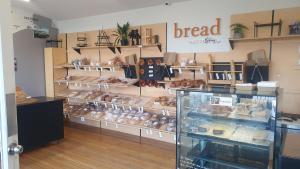 a bakery with a display of breads and other baked goods at Remarkable studio,close to airport in Queenstown +19 photos