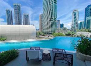 a swimming pool with a view of the city at Hotel Residence at Novotel in Manila