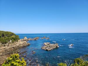 a group of rocks in a body of water at 古民家宿懐 in Nachikatsuura