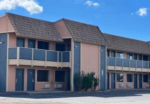 a large building with a lot of windows at Oasis Inn and Suites in Fallon