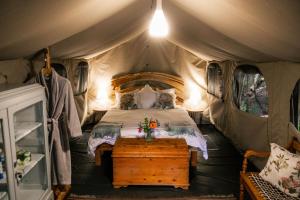 a bedroom with a bed in a tent at HighlandsView in Swellendam