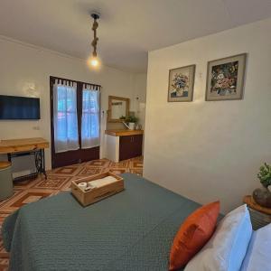 a bedroom with a bed with a box on it at Casa de Myra in Palayan City