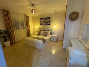 a bedroom with a bed in a room with at Ramo house Central Comfort with Views in Chefchaouen +17 photos