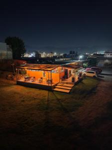 a house that is lit up at night at EL MIRADOR dlr HR in Quetzaltenango +4 photos