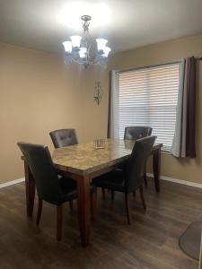 a dining room with a table and chairs at Kindness Dwells in Killeen