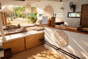 a kitchen with a counter with a counter top at Last Hammock Beach Resort in Baan Khai