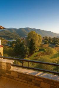 a balcony with a view of a mountain at Philoxenia in Kavála
