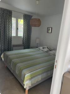 a bedroom with a bed and a window with curtains at Chioselle in Chiatra