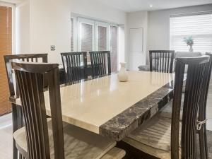 a dining room with a table and chairs at Gokula House in Cockermouth