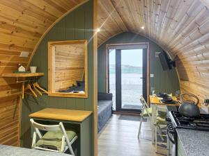 a kitchen and dining room in a tiny house at Curlew - Uk51340 in Draughton