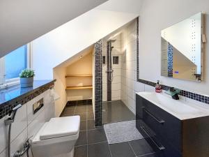 a bathroom with a toilet and a sink and a shower at The Wendover in Rowen