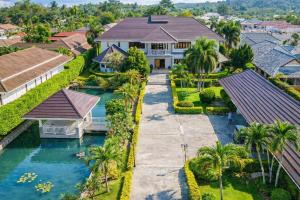 an aerial view of a house with a river at Baan Katthaliya in Hua Hin