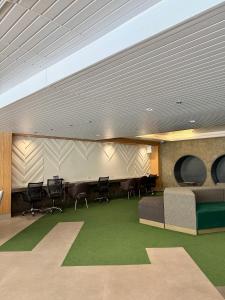 a conference room with chairs and a table in a building at Blanc Suite in Dasmariñas