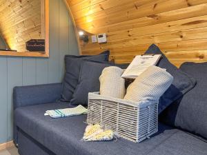 a couch with wicker baskets on it in a room at Swallow - Uk51347 in Draughton