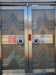 a metal door with arrows painted on it at Ye Stay in Daegu +36 photos