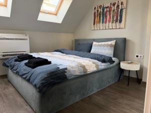 a bedroom with a large bed in a room at Luxury flat 2 in Pleven +3 photos