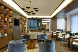 a hotel lobby with chairs and tables at Bridgewater Marriott in Bridgewater