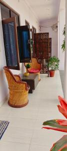 a room with two chairs and a table with mirrors at Tara pushkar in Pushkar