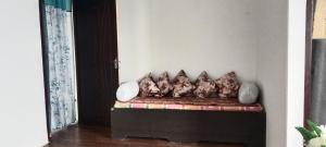 a couch with pillows on it in a room at Mamta's Homestay in Aritar