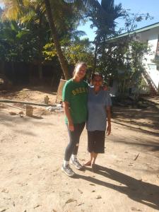 a man and a woman standing on the beach at V6 Nest in Hali Ela +7 photos