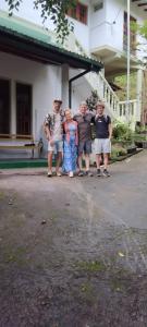 a group of people standing in front of a building at V6 Nest in Hali Ela
