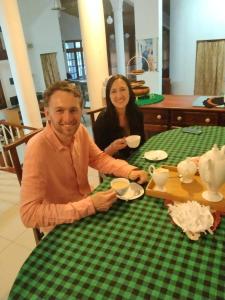 a man and a woman sitting at a table at V6 Nest in Hali Ela